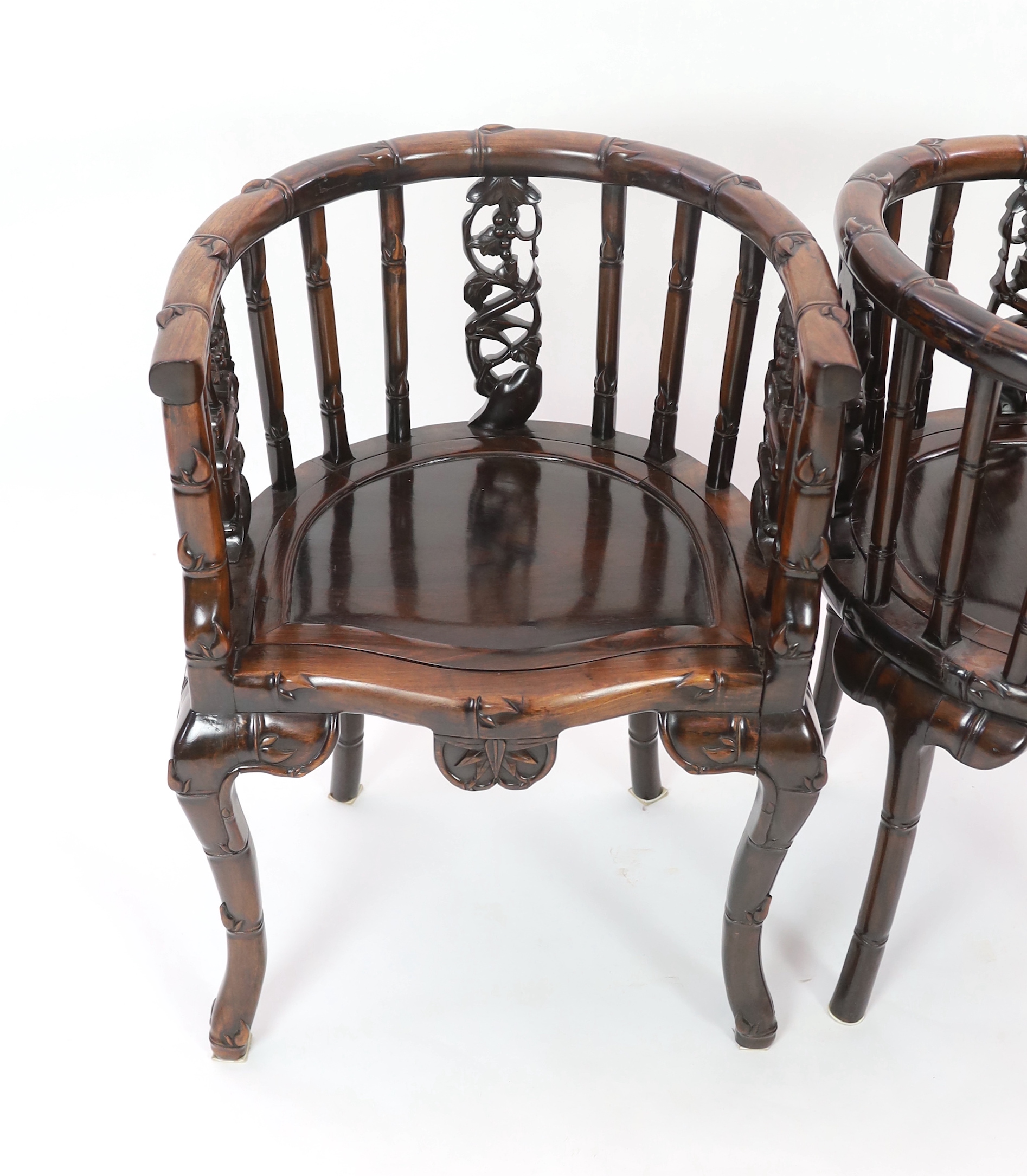 A pair of Chinese hongmu tub-shaped armchairs, late 19th century